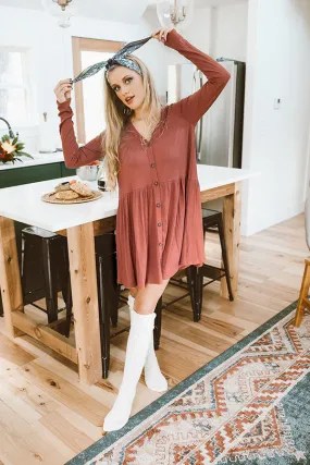 Give It A Twirl Babydoll Dress In Rust